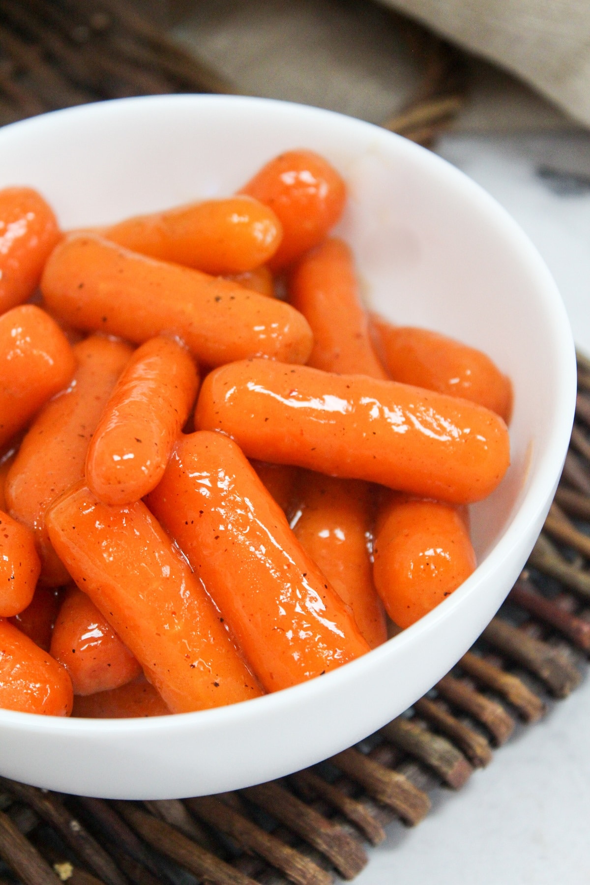 slow cooker brown sugar carrots in a white bowl