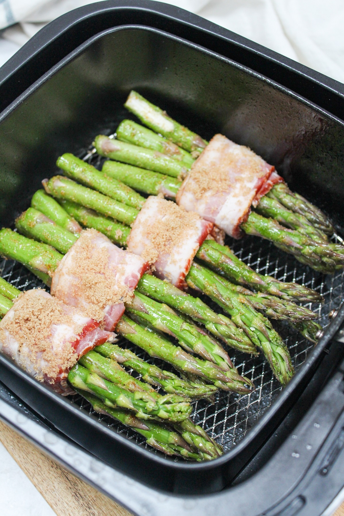 air fryer bacon wrapped asparagus in the air fryer.
