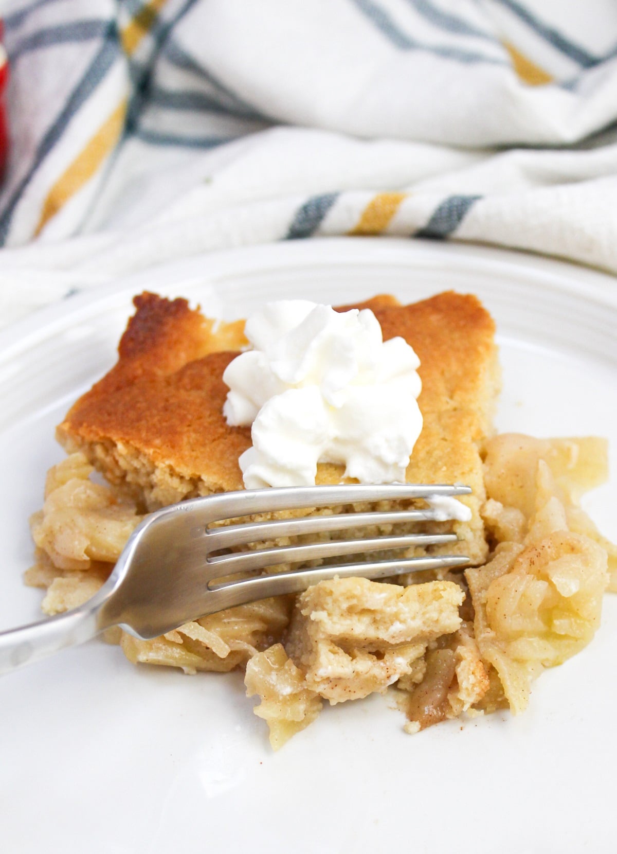 Swedish apple pie on a plate with a fork