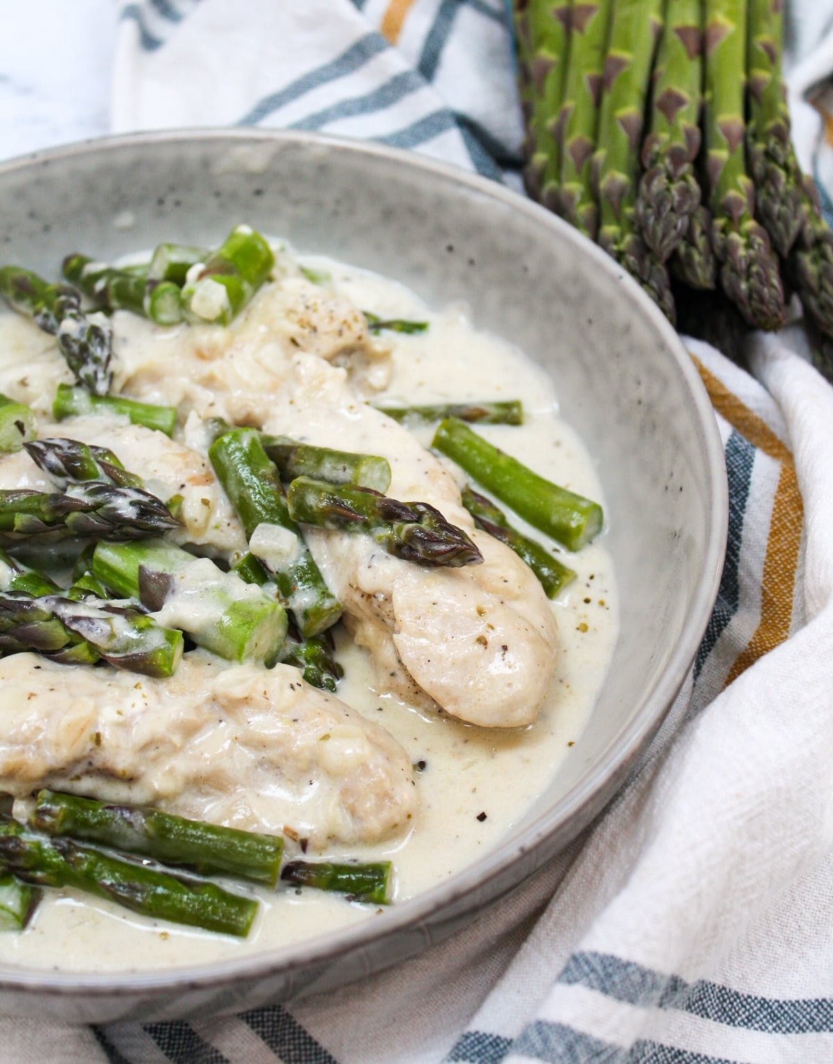 creamy keto chicken and asparagus in a bowl.