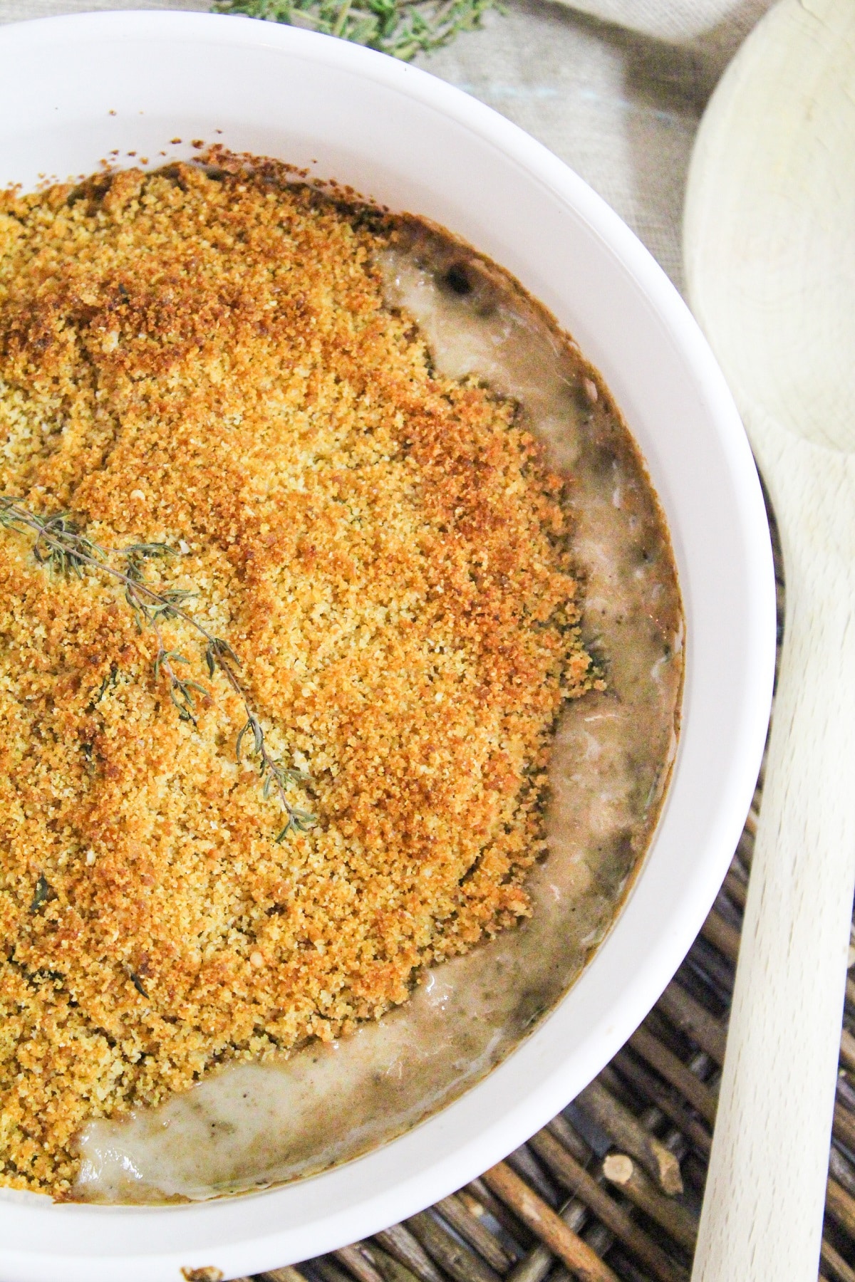 creamy mushrooms baked with a breadcrumb topping topped with fresh thyme.