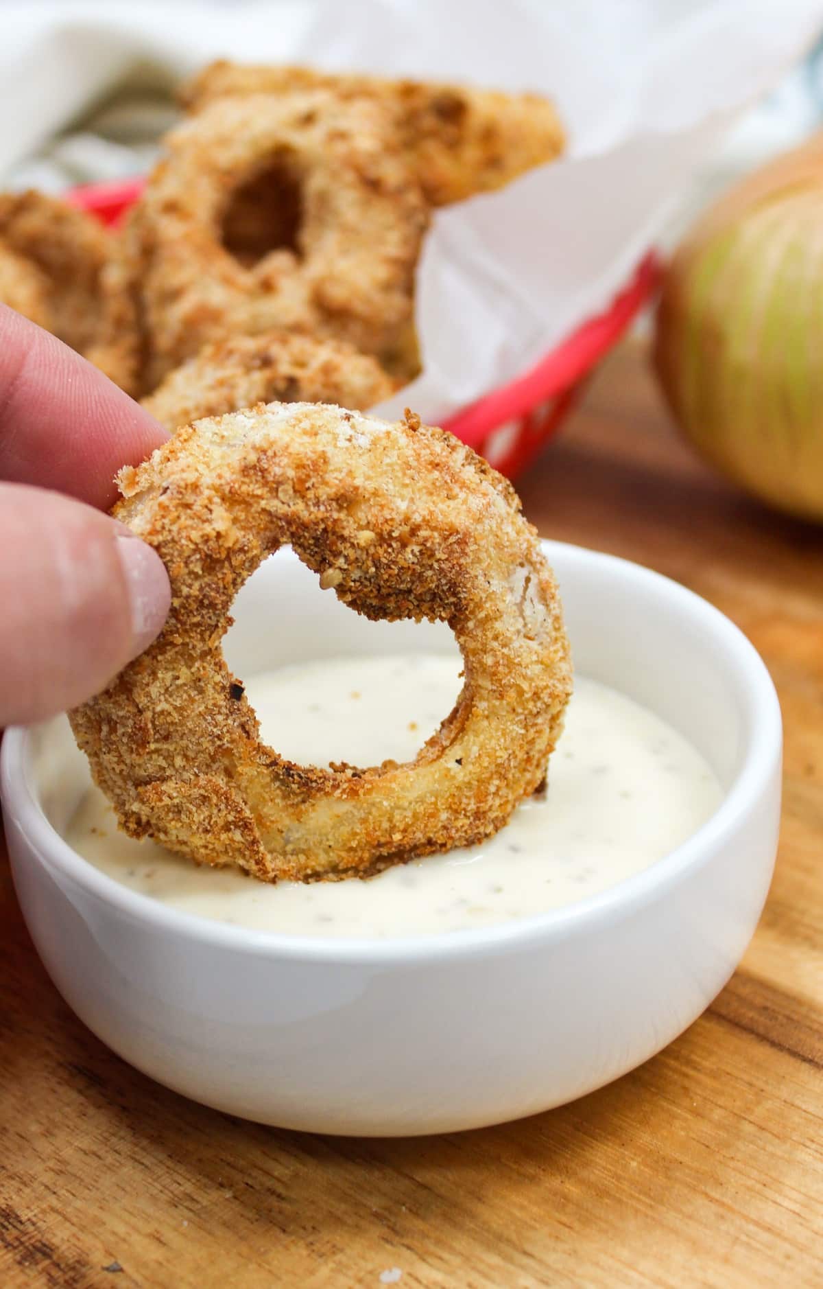 cooked onion ring dipped in ranch.